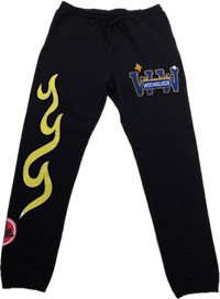 a black sweatpants with yellow flames on them